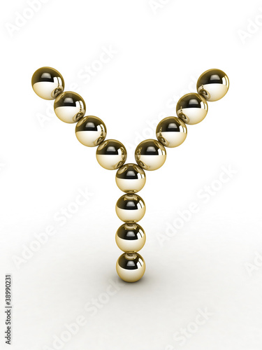 3d alphabet of gold beads.