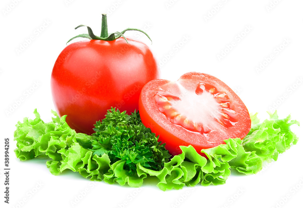 Red Ripe Tomatoes with cut and lettuce, parsley on White backgr Red Ripe Tomatoes with cut and lettuce, parsley on White backgr