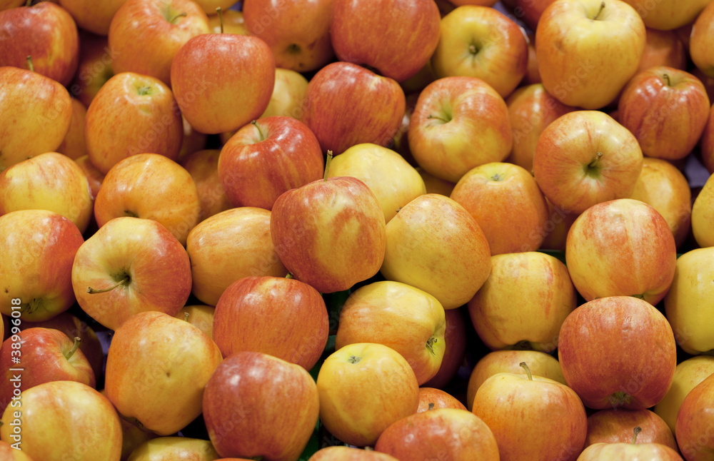 Pile of red yellow apples forming a background