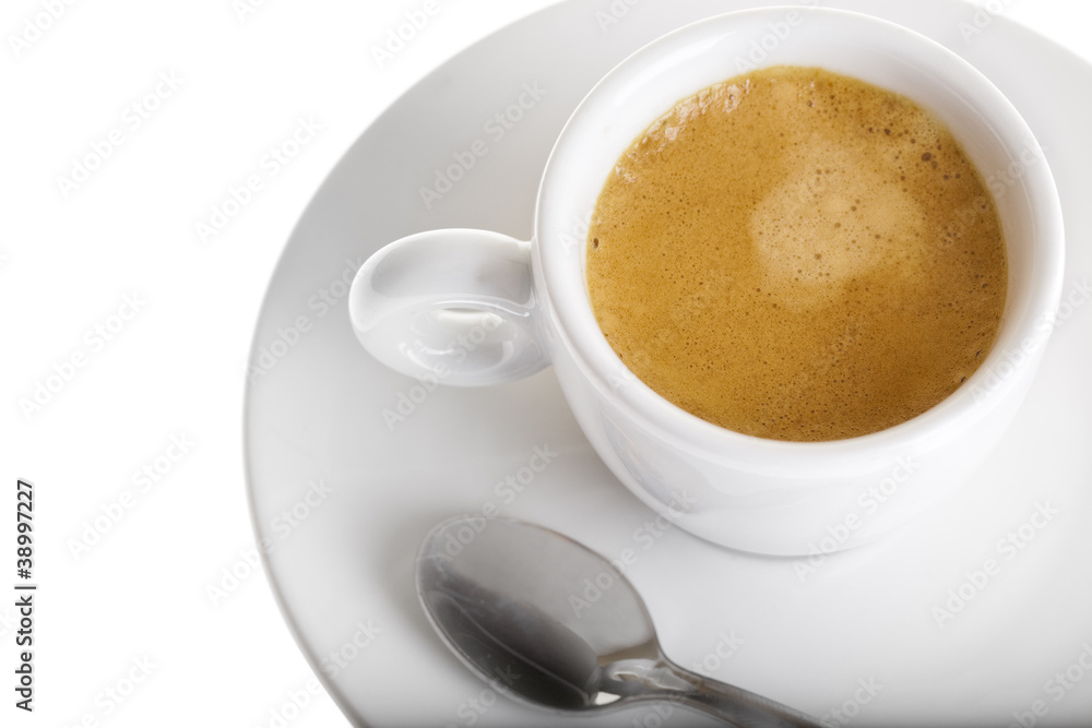 Classic espresso cup filled top view on white with spoon Classic espresso cup filled top view on white with spoon