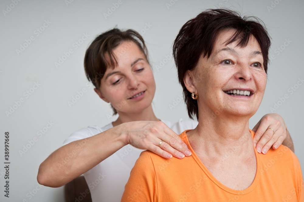 Senior fitness woman receiving massage at home Senior fitness woman receiving massage at home
