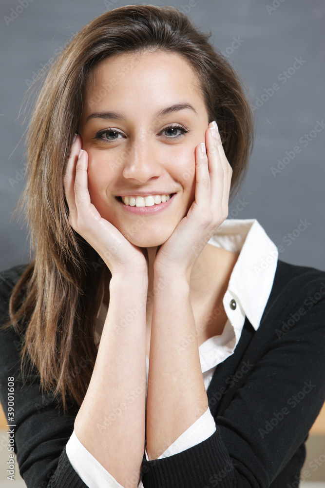 Close-up of a young woman smiling Close-up of a young woman smiling