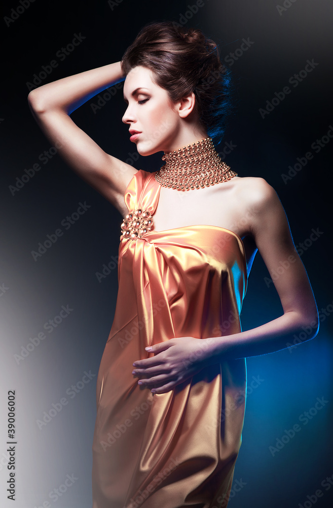 beautiful woman in long dress with jewelry