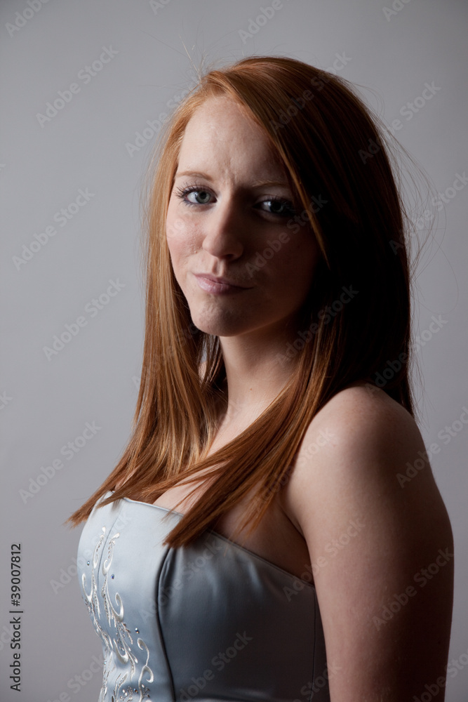 redhead woman smiling at the camera redhead woman smiling at the camera