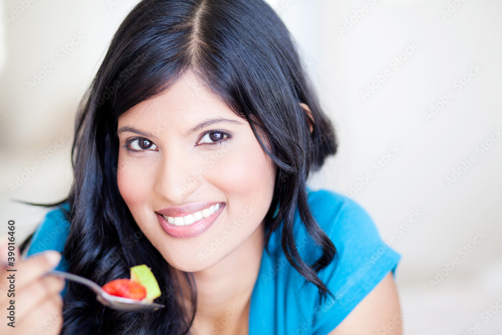 attractive healthy young woman eating fruit salad attractive healthy young woman eating fruit salad