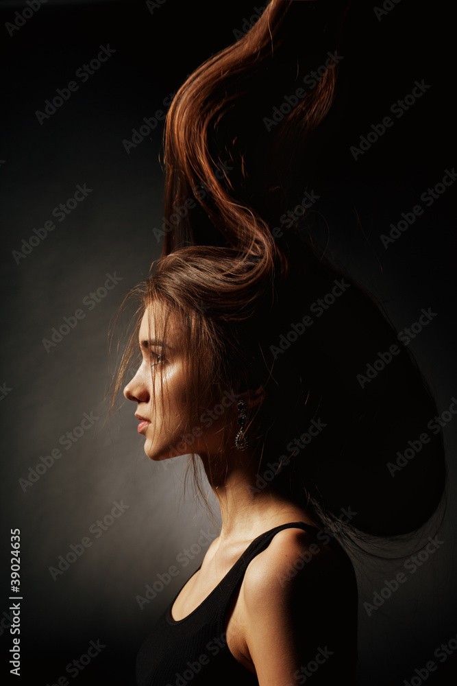 Portrait of a beautiful woman over black background Portrait of a beautiful woman over black background