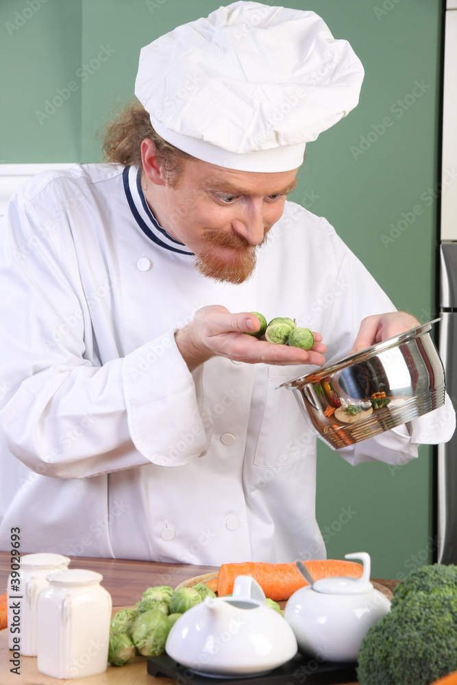 Funny young Chef with Brussels sprouts Funny young Chef with Brussels sprouts