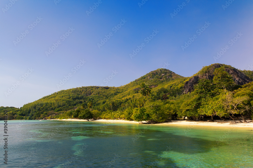 Fototapeta premium A small tropical beach by the hill.