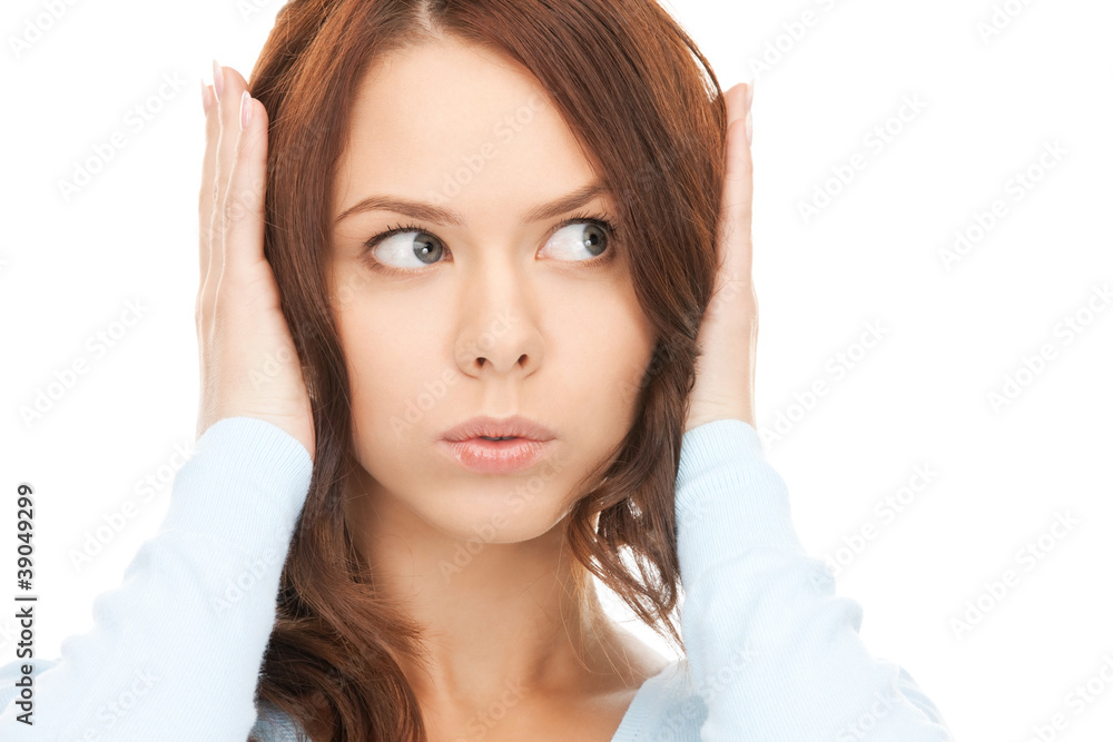 woman with hands on ears