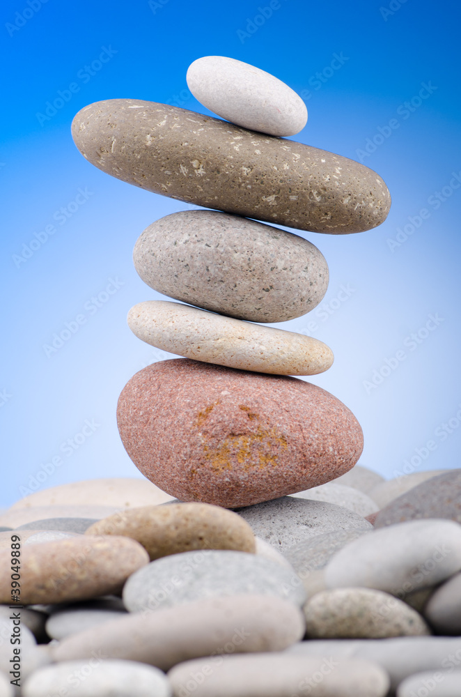 Pebbles stack against gradient background Pebbles stack against gradient background