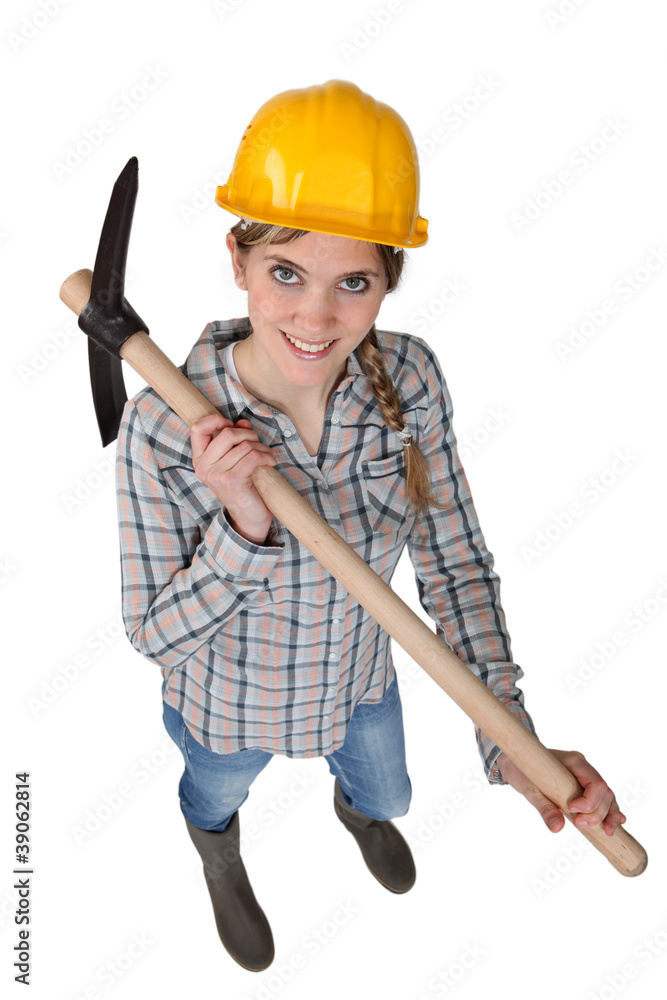 Smiling woman with a pickaxe Smiling woman with a pickaxe