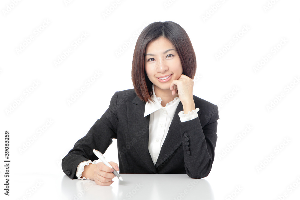 Portrait of Business woman sitting on desk with pen Portrait of Business woman sitting on desk with pen