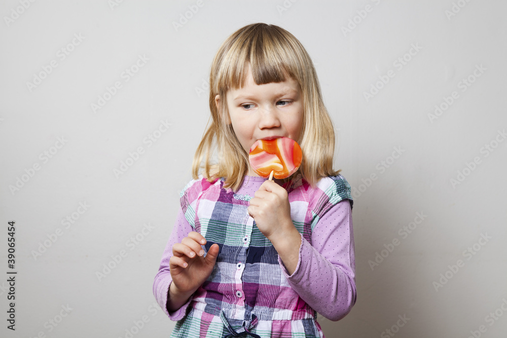 Little girl with lollipop