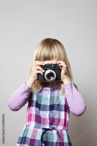 Little girl with camera © ElinaManninen