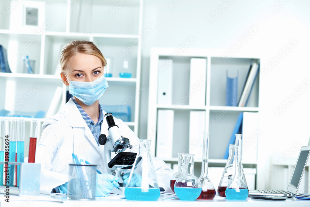 Young scientist working in laboratory Young scientist working in laboratory