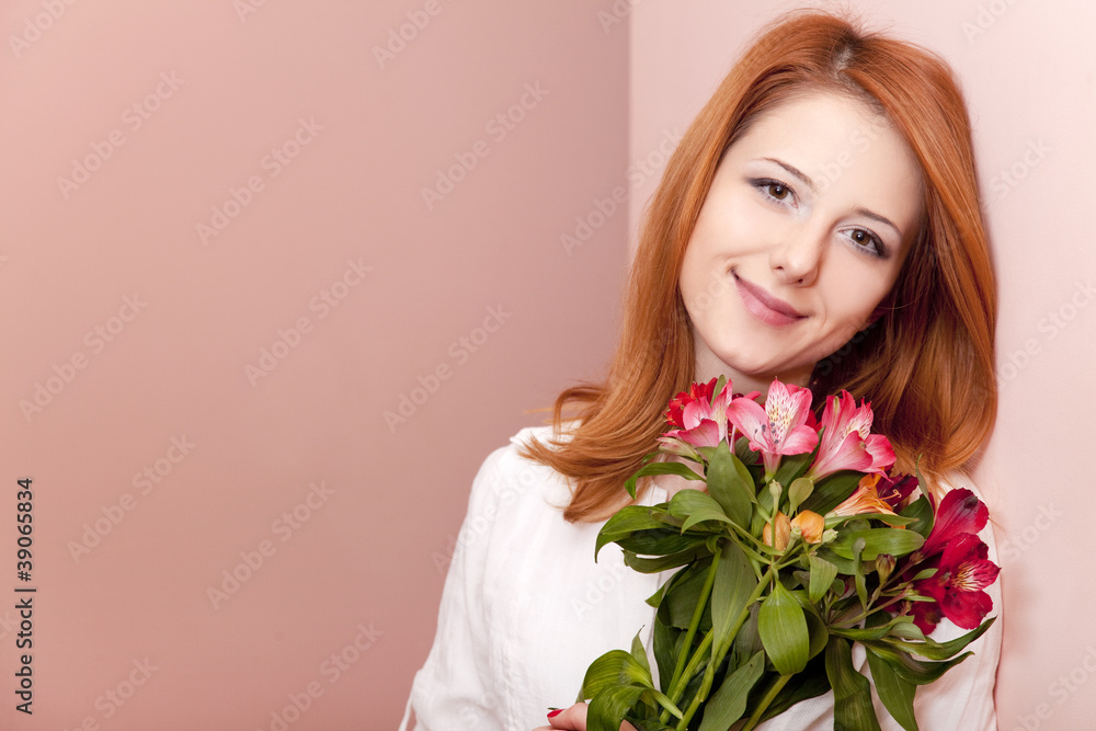 Redhead girl with flowers indoor. Redhead girl with flowers indoor.