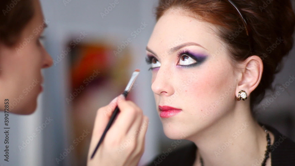 Model making-up for photography in studio.