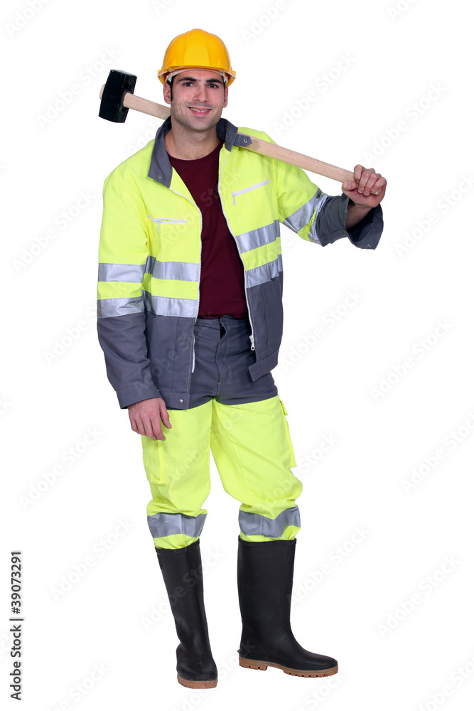Construction worker with a sledgehammer Construction worker with a sledgehammer