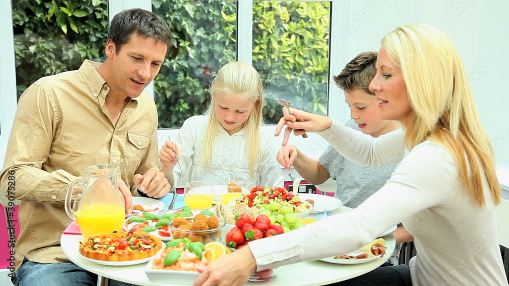 Young Family Eating Healthy Meal