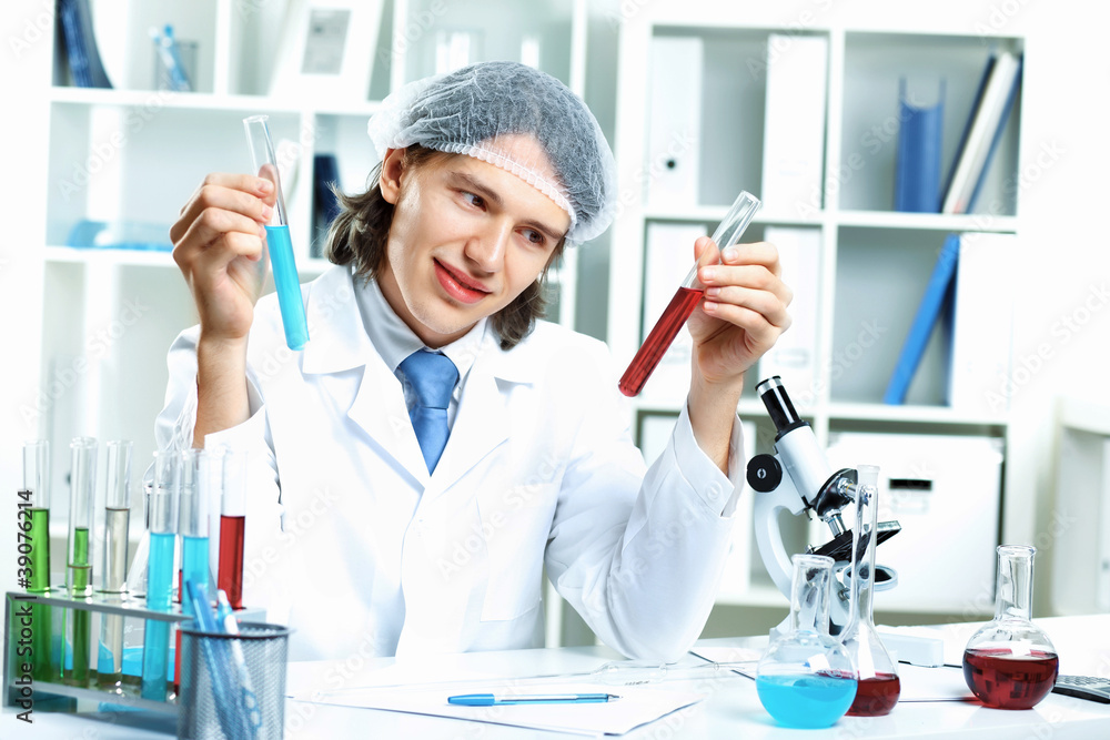 Young scientist working in laboratory Young scientist working in laboratory