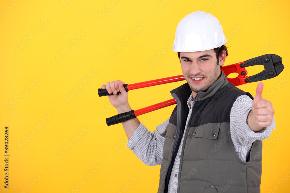 A handyman giving the thumb up. A handyman giving the thumb up.