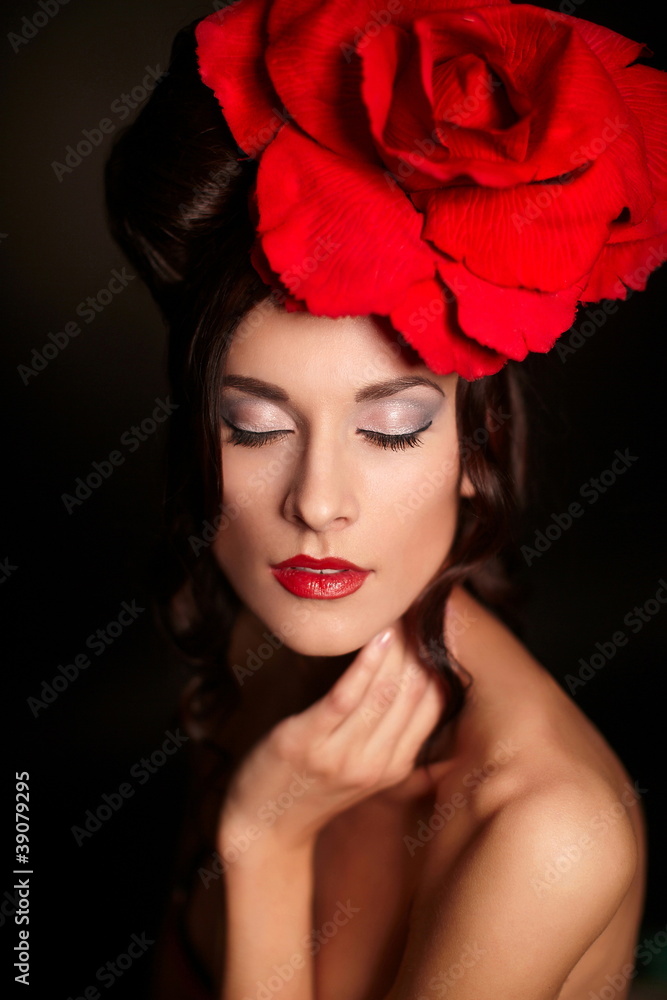 fashion woman with bright makeup lips with big red rose on head