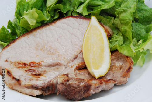 braciola di suino con insalata photo