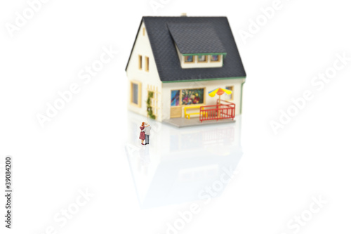 miniature people with house