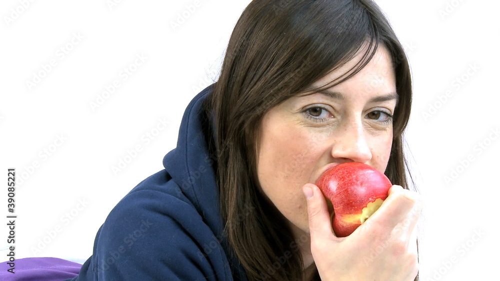young woman eating red apple smiling young woman eating red apple smiling