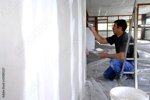 Photography Man plastering a wall