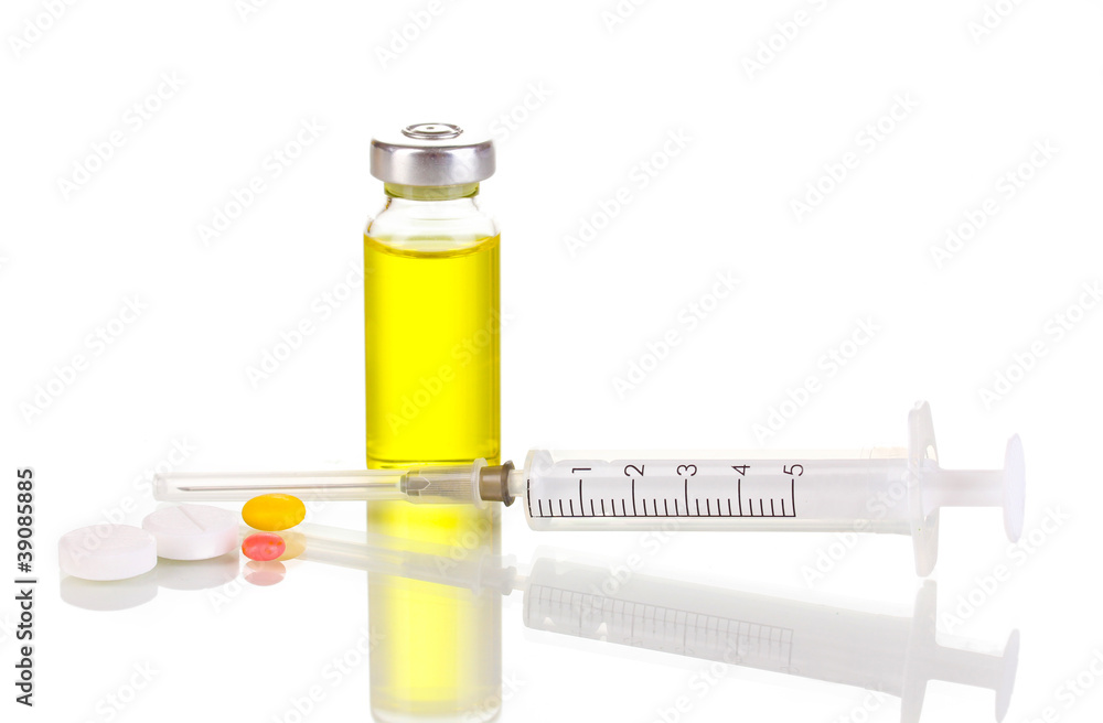 Syringe with medical ampoule and tablets isolated on white Syringe with medical ampoule and tablets isolated on white