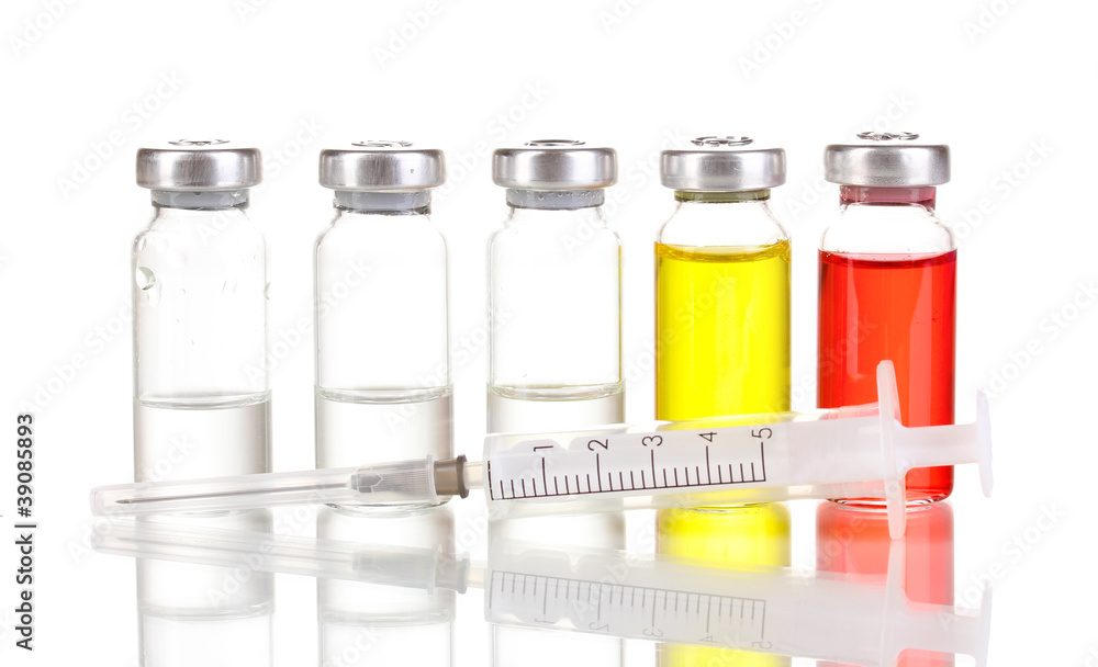 Syringe and medical ampoules isolated on white Syringe and medical ampoules isolated on white