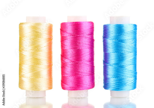 Three bobbin thread isolated on white