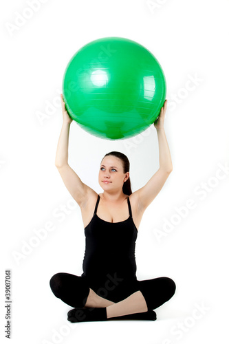 Pregnant woman excercises with gymnastic ball. Beautiful pregnan