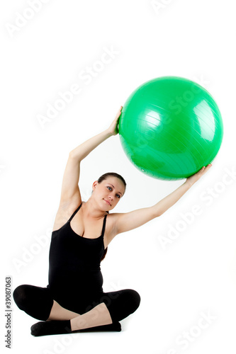 Pregnant woman excercises with gymnastic ball. Beautiful pregnan
