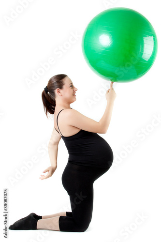 Pregnant woman excercises with gymnastic ball. Beautiful pregnan © EwaStudio