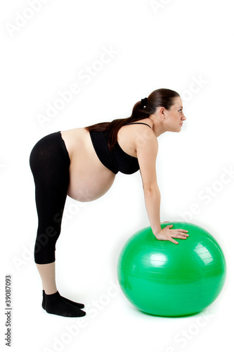 Pregnant woman excercises with gymnastic ball. Beautiful pregnan