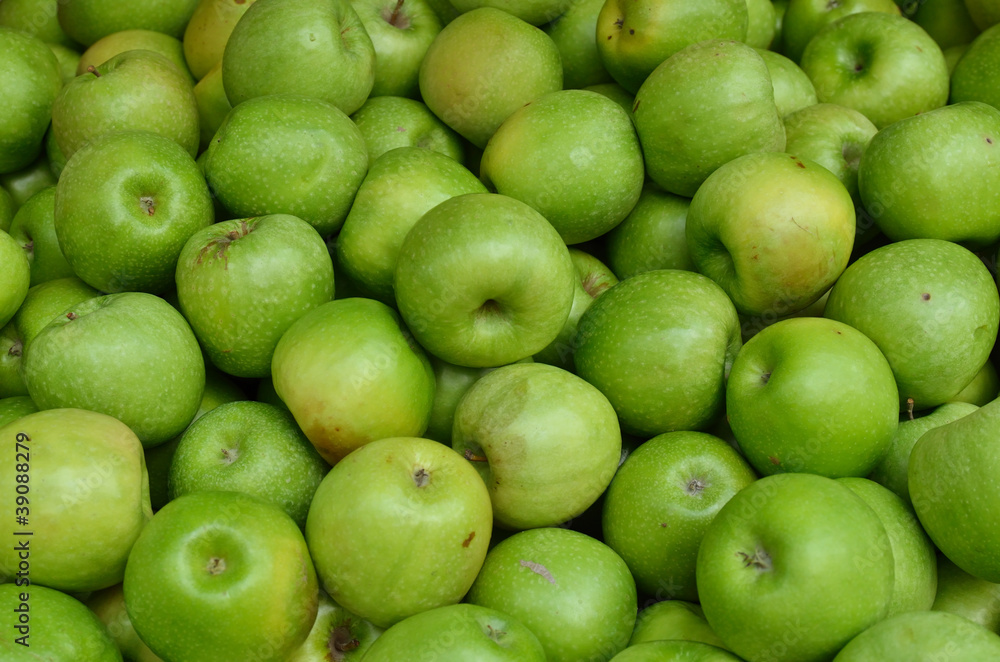 close up of green apples on market stand close up of green apples on market stand
