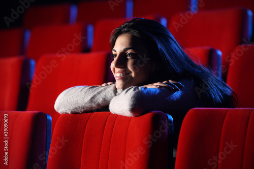 Fotografija funny movie: portrait of a pretty girl in a movie theater, she l