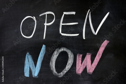 "open now" words written on chalkboard