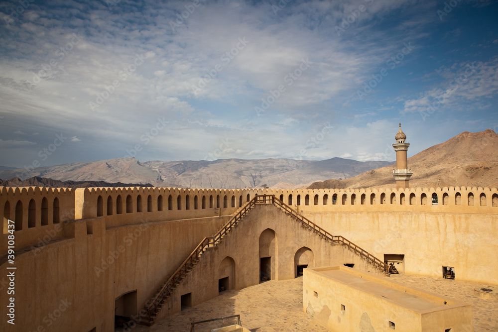 Stunning view of the Nizwa fort surrounded by mountains