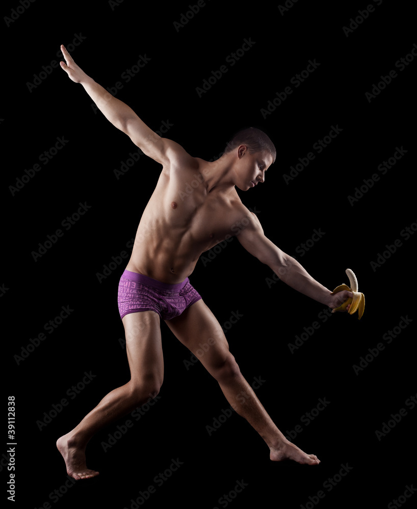 nude athletic striptease man posing with banana nude athletic striptease man posing with banana
