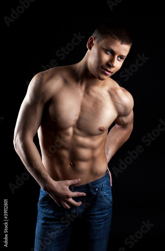 Strong naked man portrait in jeans