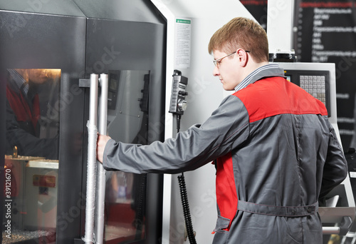 Canvas Print laborer working with machine tool