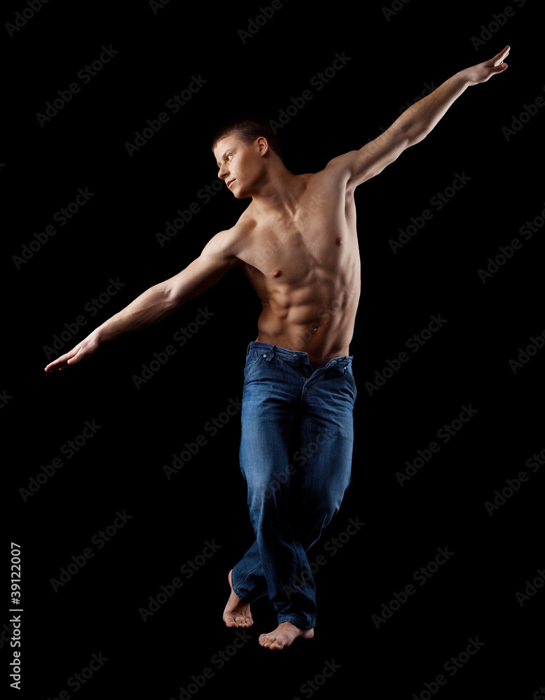 man with naked torso in jeans posing in dark man with naked torso in jeans posing in dark