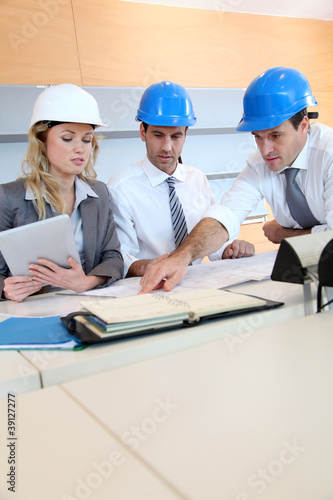 Architects and businesswomen working on construction project