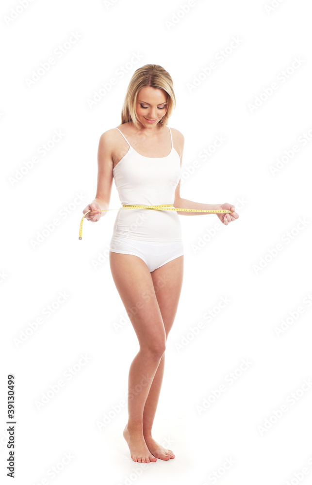 A young and fit blond woman on a white background A young and fit blond woman on a white background