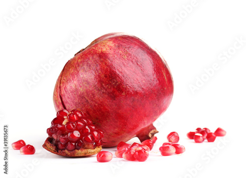 ripe pomegranate fruit isolated on white photo