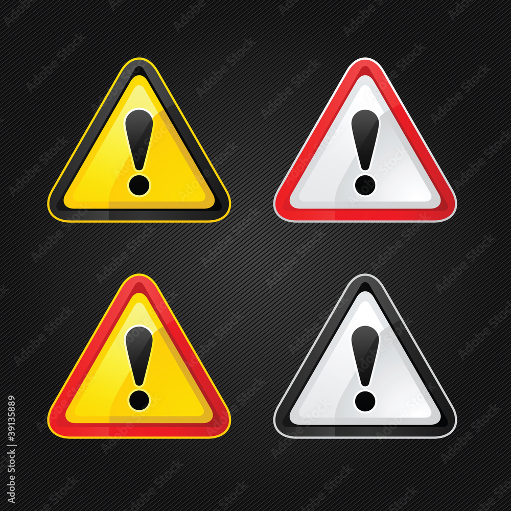 Hazard warning attention sign set on a metal surface Hazard warning attention sign set on a metal surface