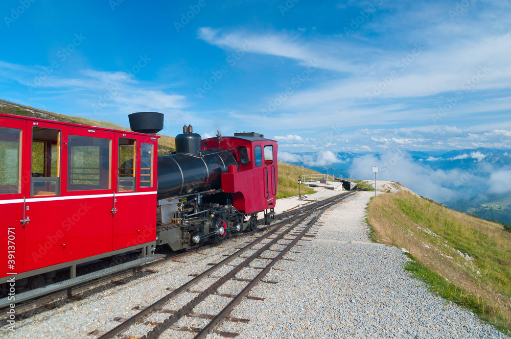 Cog railway train climbing up to the mountain Cog railway train climbing up to the mountain